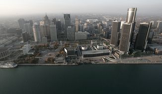 FILE - In this Nov. 2, 2005 file photo, the Detroit skyline is shown along the Detroit River. Detroit has reached a tentative deal with unions that represent thousands of employees in the bankrupt city. Mediators announced Monday, April 28, 2014 that the city and the Coalition of Detroit Unions have agreed in principle on the &amp;#8220;major aspects&amp;#8221; of a five-year collective bargaining agreement.(AP Photo/Paul Sancya, File)
