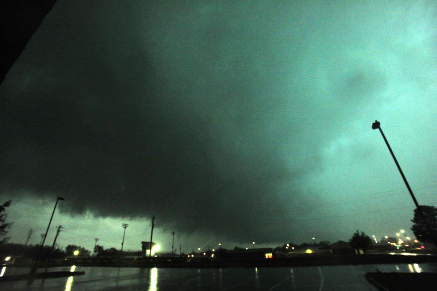 A view of a rain-wrapped tornado looking south from Hazel Green High School is seen as multiple tornadoes raked across Hazel Green and northern Madison County late afternoon Monday, April 28, 2014, in Hazel Green, Ala. (AP Photo/AL.com, Eric Schultz)