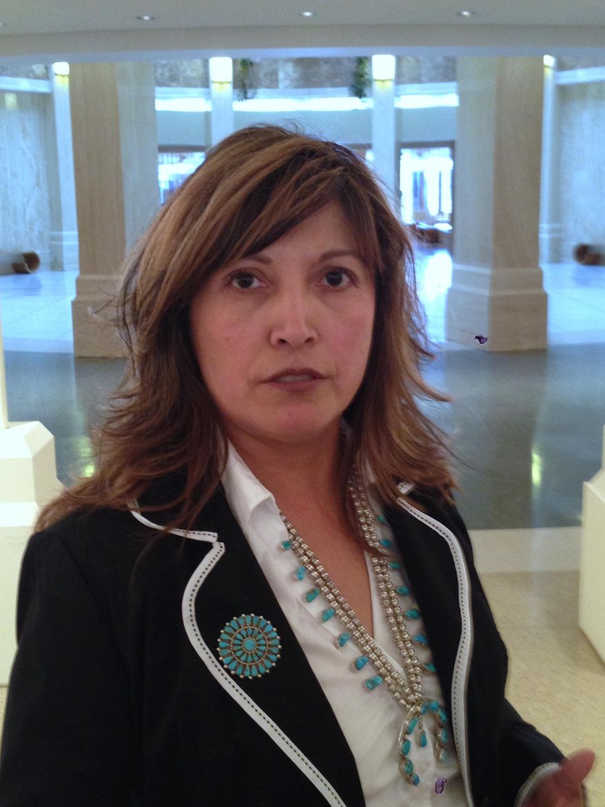 New Mexico Democratic Rep. Sandra Jeff of Crownpoint announces Tuesday, April, Apr. 29, 2014 at a news conference in the New Mexico State Capitol in Santa Fe, N.M., that she will run as a write-in candidate in the November general election after losing a court fight to appear on the June 3 Democratic primary election ballot. Jeff, a member of the Navajo Nation, is among five Native Americans serving in the 70-member House. (AP Photo/Barry Massey)