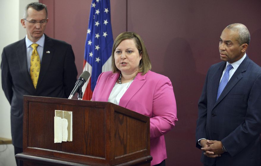 Erin Deveney, interim head of the Massachusetts Department of Children and Families, center, speaks as Health and Human Services Secretary John Polanowicz, left, and Gov. Deval Patrick, right, stand alongside Tuesday, April 29, 2014 in Boston. Deveney's appointment came following the resignation of DCF Commissioner Olga Roche, following the deaths of three children in DCF oversight. (AP Photo/Josh Reynolds)