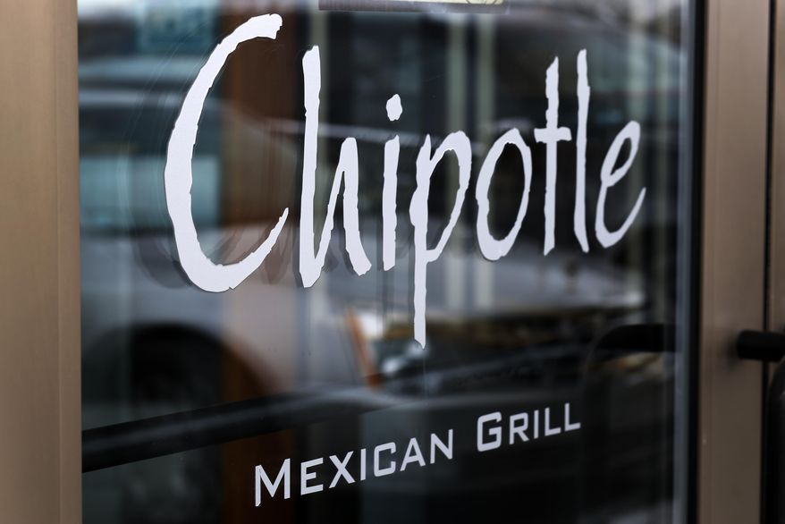 This Tuesday, Jan. 28, 2014, file photo, shows the door at a Chipotle Mexican Grill in Robinson Township, Pa. (AP Photo/Gene J. Puskar, File) ** FILE **