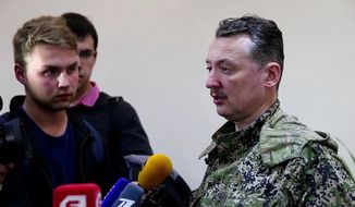 This image taken from Associated Press video shows Igor Strelkov, military commander of pro-Russian militias in Slovyansk talking to journalists in Slovyansk, Ukraine, Sunday, April 27, 2014. Strelkov has been identified as a Russian security services operative by Ukraine&#x27;s government. In what appeared to be a closely vetted interview to Russian media, Strelkov did not directly deny the accusation, saying the uprising in Ukraine was being carried out by opponents of the &amp;quot;Kiev junta&amp;quot; — language similar in tone to that adopted by the Kremlin leadership. (AP Photo/Associated Press Video)