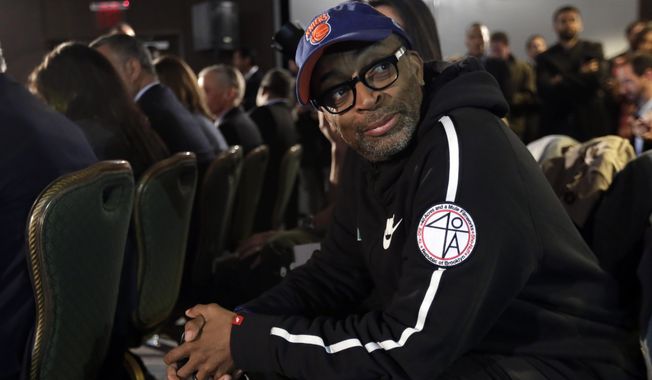 Filmmaker and avid basketball fan Spike Lee attends a news conference by NBA Commissioner Adam Silver in New York, Tuesday, April 29, 2014. Silver announced that Los Angeles Clippers owner Donald Sterling has been banned for life by the league in response to racist comments the league says he made in a recorded conversation. (AP Photo/Richard Drew)