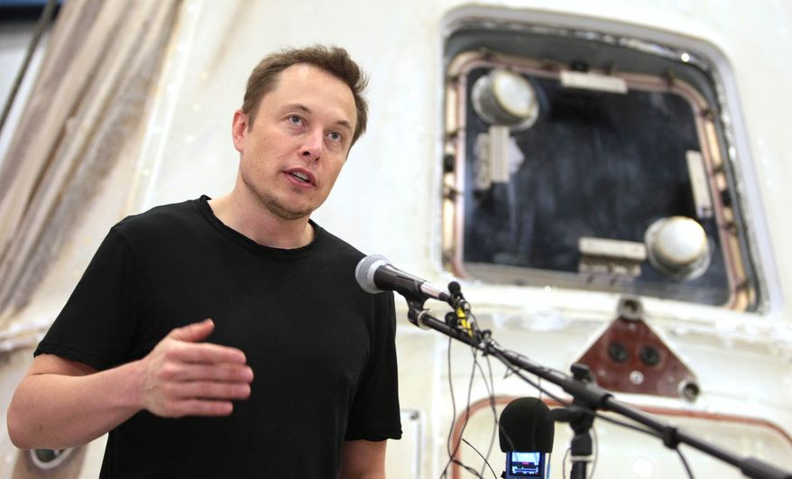 FILE - In this June 13, 2012 file photo, SpaceX CEO Elon Musk answers questions in front of the SpaceX Dragon spacecraft at the SpaceX Rocket Development Facility in McGregor, Texas. SpaceX filed a lawsuit Monday, April 28, 2014, that challenges a contract awarded to a joint venture between Boeing and Lockheed Martin to supply 36 rocket cores to the Air Force to send national security equipment into space. SpaceX says the contract should have been open to other bidders and the suit calls for certain launches to be open to competition. (AP Photo/Waco Tribune-Herald, Duane A. Laverty, File)