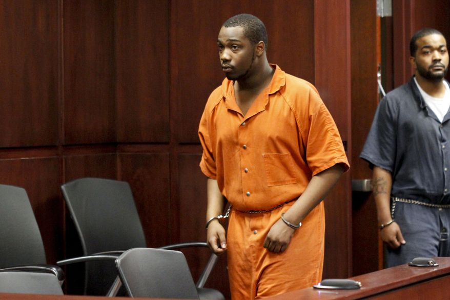 Shundarius Lawson walks into Muskegon County District Judge Michael J. Nolan's courtroom for an arraignment on Wednesday, April 30, 2014 in Muskegon, Mich. Muskegon County Prosecutor D.J. Hilson says Lawson, 20, was in a sport utility vehicle from which shots were fired that killed 17-year-old Marquis Gresham on April 23. According to Hilson, the investigation is continuing, and more charges against others are possible. Gresham was a junior and a starting center on the Muskegon Heights Public School Academy team that advanced to the state semifinals. (AP Photo/The Muskegon Chronicle, Madelyn Hastings) ALL LOCAL TV OUT; LOCAL TV INTERNET OUT