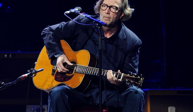 FILE - In this Feb. 18, 2010 file photo, Eric Clapton performs in concert at Madison Square Garden in New York. Clapton is paying tribute to his late friend and collaborator J.J. Cale with a new album.  Tom Petty, Willie Nelson, John Mayer and others lend a hand on &amp;quot;The Breeze: An Appreciation of J.J. Cale,&amp;quot; due out July 29. The album includes 16 Cale songs reimagined by Clapton and the all-star group of friends. Cale, architect of the Tulsa Sound and a widely influential figure in rock &#x27;n&#x27; roll history, died last year at 74. (AP Photo/Evan Agostini)
