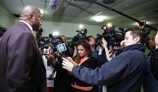 Former NBA star Magic Johnson speaks during a news conference in Saginaw, Mich., Tuesday, April 29, 2014. Johnson answered questions about Los Angeles Clippers owner Donald Sterling, whom NBA Commissioner Adam Silver banned for life from the league. (AP Photo/The Saginaw News, Neil Barris)