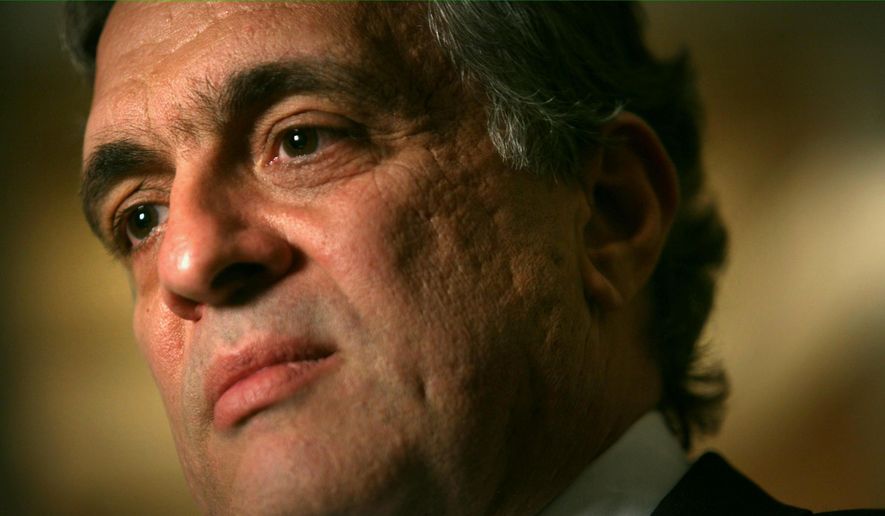 George Tenet, former CIA director, listens during an interview in New York in this April 30, 2007, file photo. (AP Photos/Bebeto Matthews, File)