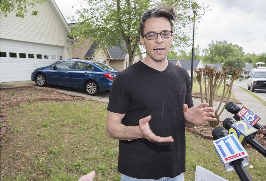 Scott Kramer, 42, father of Geddy Kramer, the 19 year-old shooter at the Kennesaw Georgia Federal Express Ground facility on Tuesday, tells the media that all the attention needs to focus on the victims that endured the actions of his son, during a short press conference Wednesday, April, 30,2014, on his front lawn inside the McEver Park subdivision in Acworth, Georgia. Kramer said his son had been quiet and moody but he just assumed it was typical teenager behavior. (AP Photo/Marietta Daily Journal, Kelly J. Huff)