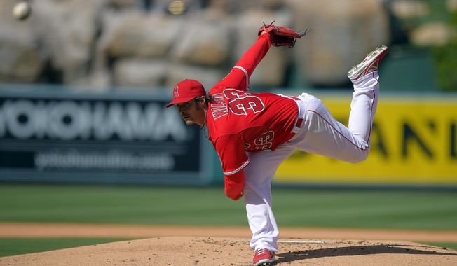 Los Angeles Angels starting pitcher C.J. Wilson throws to the plate during the first inning of a baseball game against the Cleveland Indians, Wednesday, April 30, 2014, in Anaheim, Calif. (AP Photo)