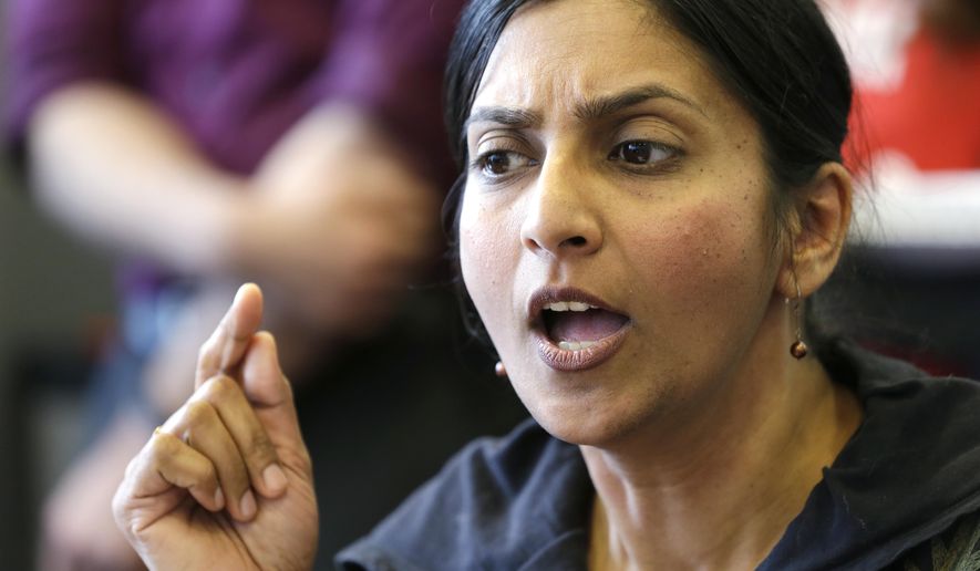 Seattle City Council Member Kshama Sawant addresses a news conference on a proposal to increase the minimum wage in the city, in Seattle, in this April 24, 2014, file photo. (AP Photo/Elaine Thompson, File) ** FILE **