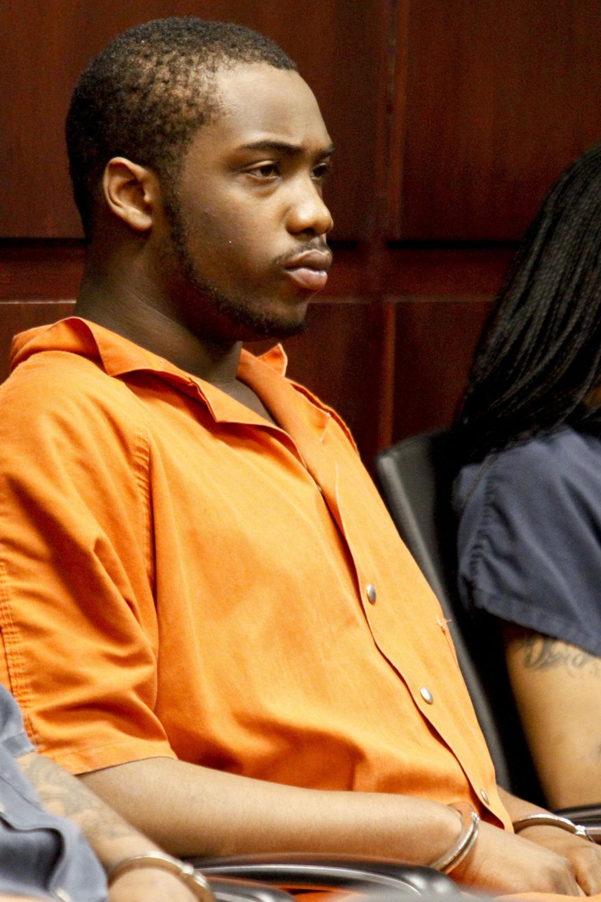 Shundarius Lawson sits in Muskegon County District Judge Michael J. Nolan's courtroom for an arraignment on Wednesday, April 30, 2014 in Muskegon, Mich. Muskegon County Prosecutor D.J. Hilson says Lawson, 20, was in a sport utility vehicle from which shots were fired that killed 17-year-old Marquis Gresham on April 23. According to Hilson, the investigation is continuing, and more charges against others are possible. Gresham was a junior and a starting center on the Muskegon Heights Public School Academy team that advanced to the state semifinals. (AP Photo/The Muskegon Chronicle, Madelyn Hastings) ALL LOCAL TV OUT; LOCAL TV INTERNET OUT