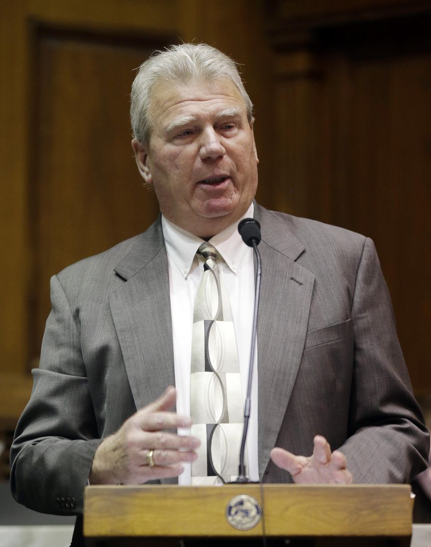 FILE- In this Jan. 13, 2014 file photo, Republican House Speaker Pro Tem Eric Turner, R-Cicero, presents a proposed amendment to the state's constitution to ban gay marriage during a hearing of the House elections committee at the Statehouse in Indianapolis. The House Ethics Committee meets to vote on whether Rep. Eric Turner violated state ethics laws when he lobbied in caucus to kill a nursing home ban that would have cost his family millions. (AP Photo/Michael Conroy, file)