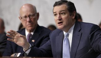 ** FILE ** Senate Rules Committee member Sen. Ted Cruz, R-Texas, right, joined by the committee&#39;s ranking member Sen. Pat Roberts, R-Kansas, speaks on Capitol Hill in Washington, Wednesday, April 30, 2014. (AP Photo)