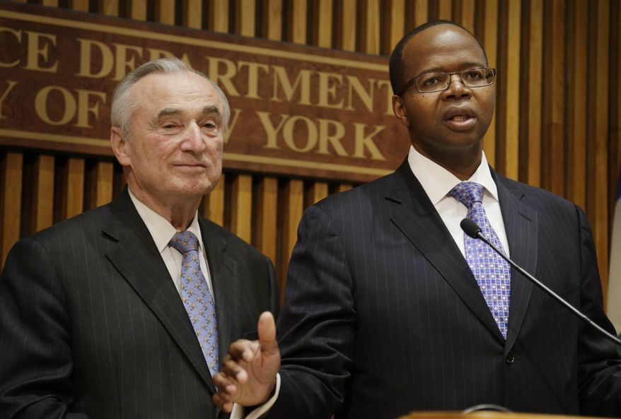 New York City Police Commissioner Bill Bratton, left, and Brooklyn District Attorney Kenneth Thompson speak to reporters during a news conference at police headquarters in New York, Wednesday, April 30, 2014. Authorities in New York City say they've arrested six people and charged them with selling 155 guns transported from Georgia to an undercover officer in Brooklyn. (AP Photo/Seth Wenig)