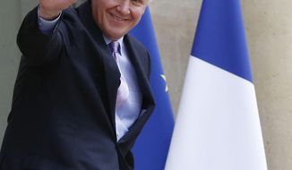 FILE - In this April 28, 2014 file photo, General Electric Co. CEO Jeffrey R. Immelt leaves the Elysee Palace after meeting with French President Francois Hollande in Paris. General Electric inched closer to buying the energy-related businesses of France&#39;s Alstom by making a $16.9 billion bid, but rival offers and political concern in France may hold up or scuttle the deal. (AP Photo/Michel Euler, File)