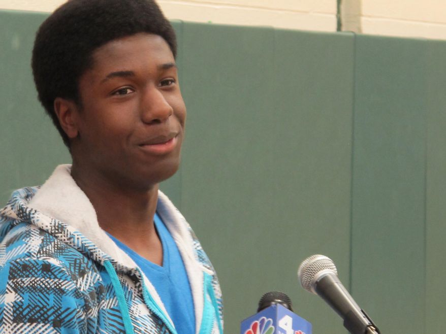 Kwasi Enin speaks at a news conference at William Floyd High School in Mastic Beach, N.Y., on Wednesday, April 30, 2014. Enin, who was accepted into all eight Ivy League colleges, announced he will attend Yale University in the fall. Enin says he wants to study medicine. His parents are both nurses and immigrated to the United States from Ghana in the 1980s. (AP Photo/Frank Eltman)