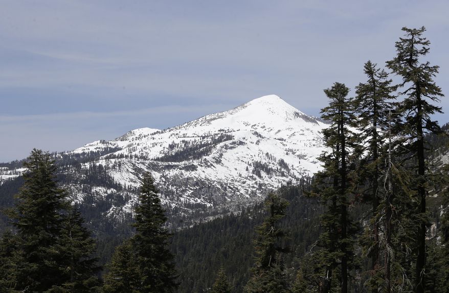 Snow covers the highest elevations of the Sierra Nevada near Echo Summit, Calif., Tuesday, May 1, 2014. The California Department of Water Resources held it's final snow survey of the season Thursday and reported that manual and electronic readings of the statewide snowpacks's water content showed it to be only 18 percent of average for this time of the year. (AP Photo/Rich Pedroncelli)