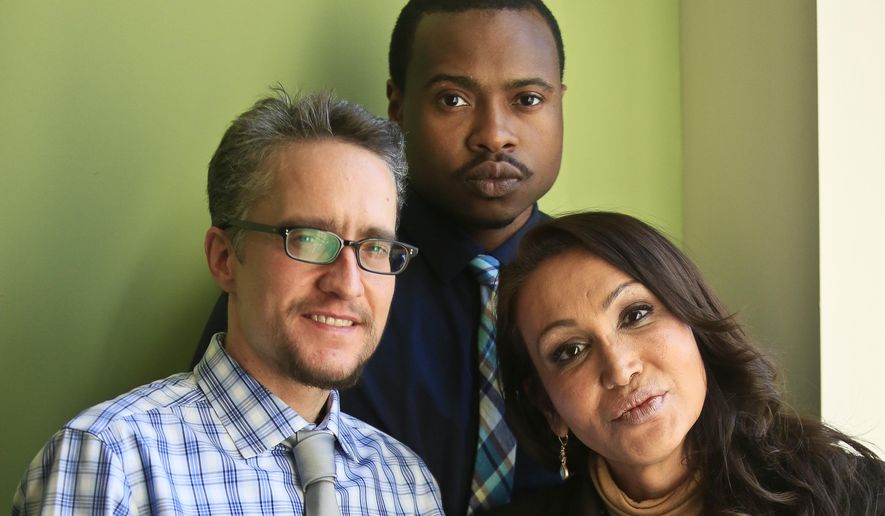 In this April 24, 2014, file photo, contributors to the new transgender reference book "Trans Bodies, Trans Selves," from left, Jack Pula, chairperson of the transgender committee of the Association of Gay and Lesbian Psychiatrists; Tiq Milan, a media strategist at GLAAD, and Cecilia Gentili, a program coordinator and consultant on transgender issues, stand together at the offices of the Oxford University Press in New York. The encyclopedic new resource book written for and by transgender people was released in May 2014. (AP Photo/Bebeto Matthews) ** FILE **