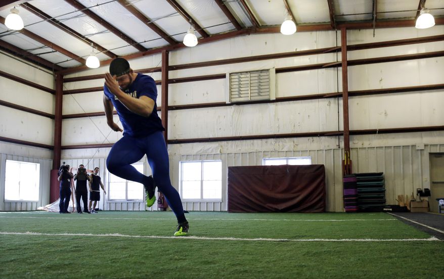 FILE - In this Friday, Feb. 14, 2014, file photo, Gallaudet defensive lineman Adham Talaat runs the 40-yard-dash at TEST Sports Clubs in Martinsville, N.J. Talaat has overcome being deaf to reach the doorstep of the NFL. After starring at Gallaudet University, working out at Test Parisi Football Academy and posted impressive numbers at his Pro Day, the talented defensive end is hopeful he&#x27;ll get a call when the NFL draft kicks off next week. (AP Photo/Mel Evans,file)