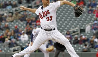 Minnesota Twins starting pitcher Mike Pelfrey (37) delivers to the Los Angeles Dodgers during the first inning in the first baseball game of a doubleheader in Minneapolis, Thursday, May 1, 2014. (AP Photo/Ann Heisenfelt)
