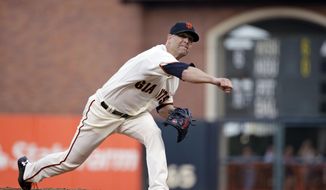 San Francisco Giants starting pitcher Tim Hudson throw against the San Diego Padres in the first inning of a baseball game Wednesday, April 30, 2014, in San Francisco. (AP Photo)