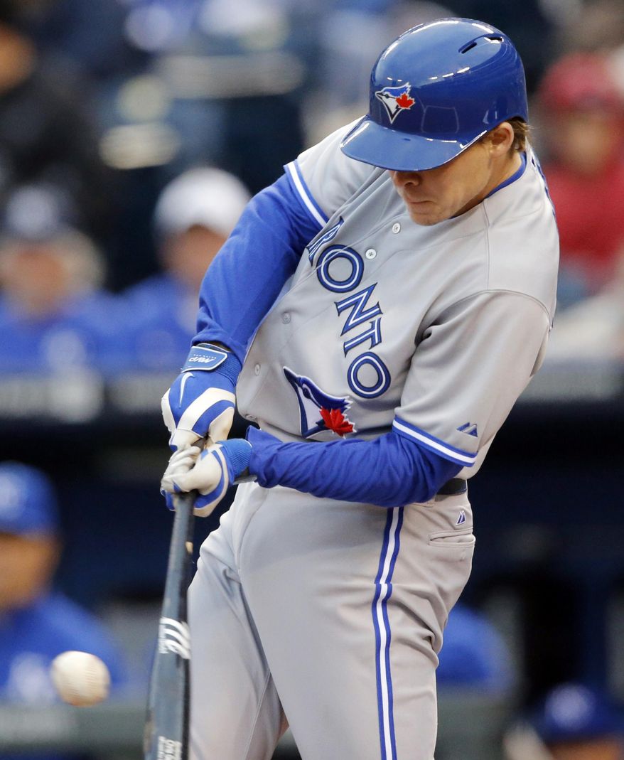 Toronto Blue Jays' Chris Getz hits a single off Kansas City Royals starting pitcher Jeremy Guthrie during the first inning of a baseball game in Kansas City, Mo., Thursday, May 1, 2014. Getz scored later in the inning. (AP Photo/Orlin Wagner)