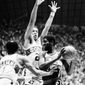 Washington Bullets Bob Dandridge (right) tries to keep the ball from the grasp of Seattle Supersonics Gus Williams (left) and John Johnson (27) during NBA Championship Game at Seattle at night on Wednesday, June 7, 1978. (AP Photo)