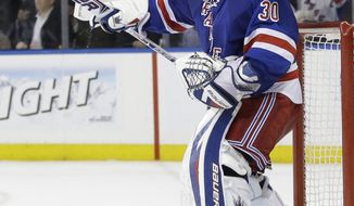 New York Rangers goalie Henrik Lundqvist (30), of Sweden, celebrates after Game 7 of an NHL hockey first-round playoff series against the Philadelphia Flyers, Wednesday, April 30, 2014, in New York. The Rangers won the game 2-1. (AP Photo)