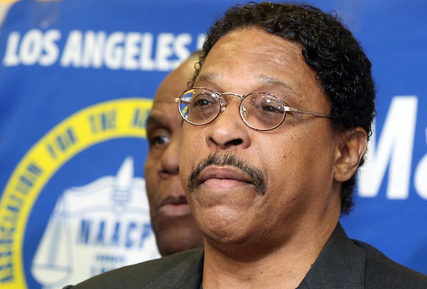 In this photo taken April 28, 2014, Leon Jenkins, president of the Los Angeles chapter of the NAACP, announces that Los Angeles Clippers basketball team owner Donald Sterling will not be receiving his lifetime achievement award, at a news conference in Culver City, Calif. Jenkins has his own legal problems, which are coming into focus now that the NBA has banned Sterling for racist comments. (AP Photo/Nick Ut)