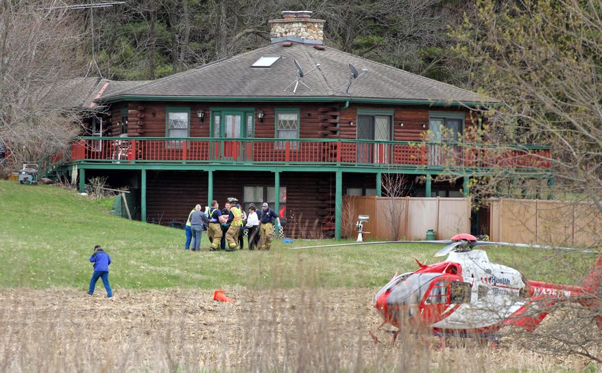 Emergency personnel carry out one of two Dane County sheriff's deputies that were both stabbed in the leg during an incident in the town of Primrose, north of New Glarus, Wis., Thursday, May 1, 2014.. An unnamed third deputy fatally shot the man who stabbed Lt. Brian Hayes and Deputy Roger Finch. The two stabbed deputies were airlifted to UW Hospital with non life-threatening injuries. (AP Photo/The Monroe Times, Anthony Wahl)
