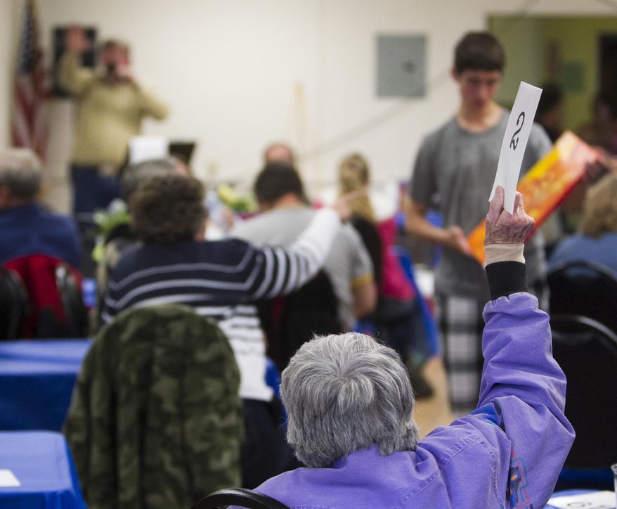 ADVANCED FOR RELEASE SATURDAY, MAY 3, 2014 Residents of New Plymouth and organizers of the Robert Manwill Scholarship Fund hold an auction to raise money to benefit Manwill's classmates when they graduate high school in 2017. (AP Photo/The Idaho Statesman, Darin Oswald)