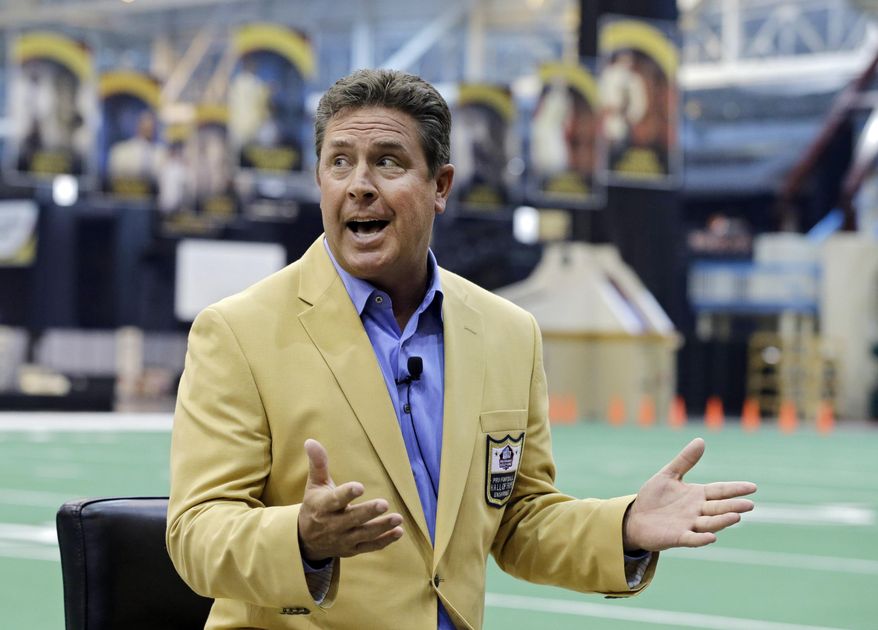 Miami Dolphins Hall of Fame quarterback Dan Marino speaks to reporters about the Pro Football Hall of Fame fanjets at the I-X Center in Cleveland Tuesday, April 29, 2014. The inaugural fanfest features 100 members of the Pro Football Hall of Fame interacting with fans May 3-4, 2014. (AP Photo)