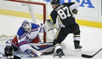 New York Rangers goalie Henrik Lundqvist (30) stops a shot by Pittsburgh Penguins&#39; Sidney Crosby (87) in the first period of Game 1 of a second-round NHL hockey playoff series in Pittsburgh, Friday, May 2, 2014. (AP Photo/Gene J. Puskar)