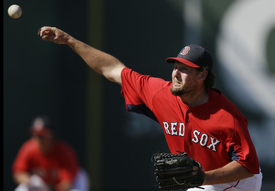 FILE-- In this March 30, 2013, file photo, Boston Red Sox relief pitcher Joel Hanrahan deliverin during an exhibition spring training baseball game against the Minnesota Twins in Fort Myers, Fla. Hanrahan has agreed to a one-year deal with the Detroit Tigers on Friday, May 2, 2014. The Tigers are hopeful the right-hander can bolster a shaky bullpen when he finally returns from elbow surgery. (AP Photo/Elise Amendola, File)