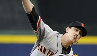San Francisco Giants starting pitcher Tim Lincecum delivers to the Atlanta Braves during the first inning of a baseball game Friday, May 2, 2014, in Atlanta. (AP Photo/David Tulis)