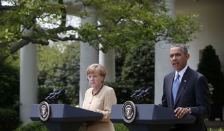 President Barack Obama and German Chancellor Angela Merkel participate in a joint news conference in the Rose Garden of the White House in Washington, Friday, May 2, 2014. Obama and Merkel are putting on a display of trans-Atlantic unity against an assertive Russia, even as sanctions imposed by Western allies seem to be doing little to change Russian President Vladimir Putin&#x27;s reasoning on Ukraine. (AP Photo/Charles Dharapak)