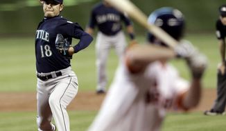 Seattle Mariners&#39; Hisashi Iwakuma (18) delivers a pitch to Houston Astros&#39; Matt Dominguez in the first inning of a baseball game on Saturday, May 3, 2014, in Houston. (AP Photo/Pat Sullivan)