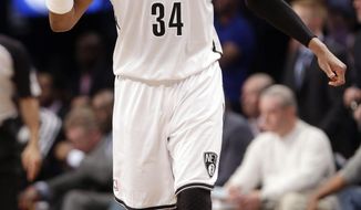 Brooklyn Nets&#39; Paul Pierce (34) reacts after teammate Andray Blatche scores during the first half of Game 6 of the opening-round NBA basketball playoff series against the Toronto Raptors, Friday, May 2, 2014, in New York. (AP Photo/Frank Franklin II)