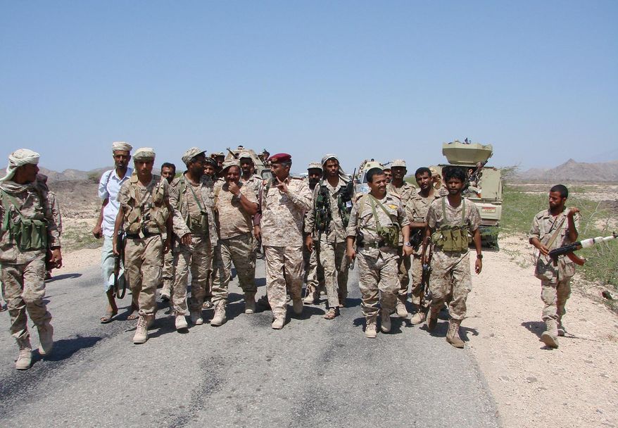 In this Friday, May 1, 2014, photo provided by Yemen&#39;s Defense Ministry, army officers and soldiers patrol a road during fighting with al-Qaida militants in Majala of the southern province of Abyan, Yemen. (AP Photo/Yemen&#39;s Defense Ministry)