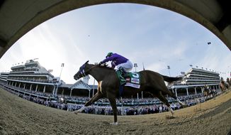 In this image taken with a fisheye lens, jockey Victor Espinoza rides California Chrome to win in the 140th running of the Kentucky Derby horse race at Churchill Downs Saturday, May 3, 2014, in Louisville, Ky. (AP Photo/Matt Slocum)