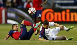 Chicago Fire midfielder Benji Joya, left, battles for the ball with Real Salt Lake defender Chris Wingert, right, during the first half of an MLS soccer game on Saturday, May 3, 2014, at Toyota Park in Bridgeview, Ill. (AP Photo/Kamil Krzaczynski)