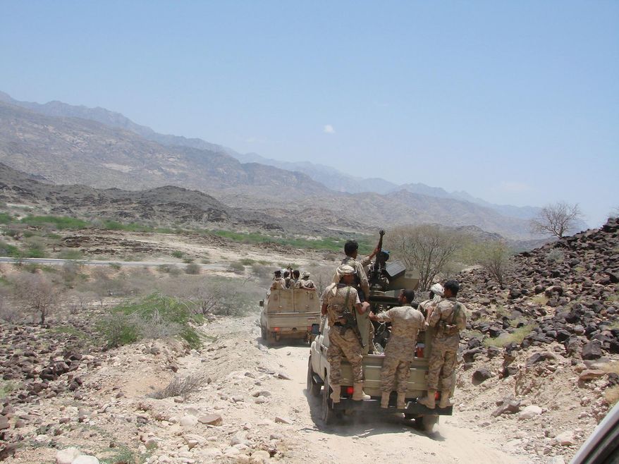 In this Thursday, May 1, 2014 photo provided by Yemen&#39;s Defense Ministry, army vehicles patrol a road during fighting with al-Qaida militants in Majala of the southern province of Abyan, Yemen. (AP Photo/Yemen&#39;s Defense Ministry)
