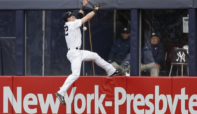 New York Yankees center fielder Jacoby Ellsbury leaps for but cannot field Tampa Bay Rays&#x27; Wil Myers&#x27; third-inning inside-the-park home run during a baseball game at Yankee Stadium in New York, Sunday, May 4, 2014. (AP Photo/Kathy Willens)