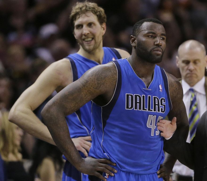 Dallas Mavericks&#39; Dirk Nowitzki, left, of Germany, and Dallas Mavericks&#39; DeJuan Blair, right, wait to enter the game after a time out during the first half of Game 7 of the opening-round NBA basketball playoff series against the San Antonio Spurs, Sunday, May 4, 2014, in San Antonio. (AP Photo/Eric Gay)