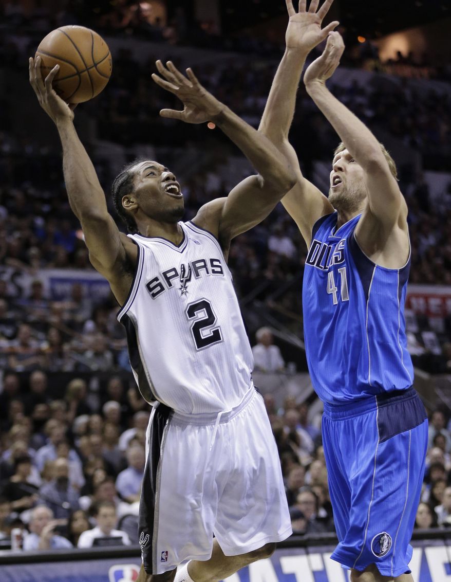 San Antonio Spurs&#39; Kawhi Leonard (2) is pressured by Dallas Mavericks&#39; Dirk Nowitzki (41), of Germany, during the first half of Game 7 of the opening-round NBA basketball playoff series, Sunday, May 4, 2014, in San Antonio. (AP Photo/Eric Gay)