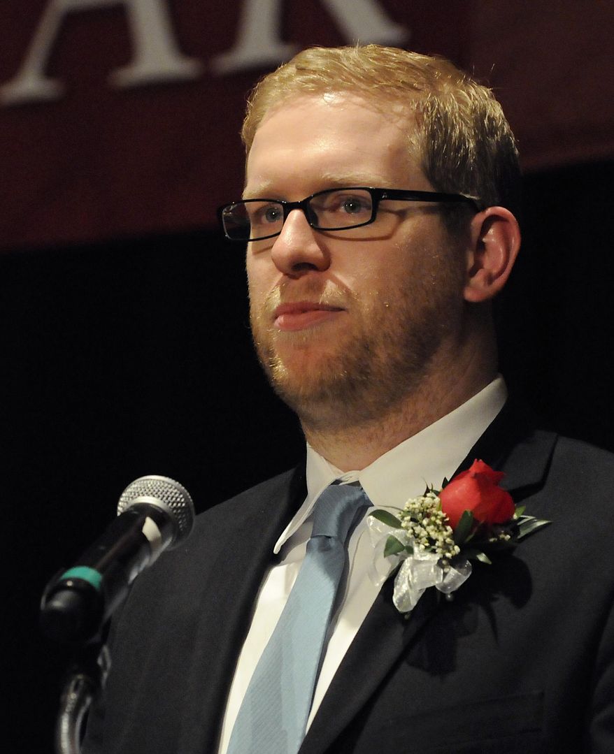 In this photo provided by Education Minnesota, Thomas Rademacher is named 2014 Minnesota Teacher of the Year in Bloomington, Minn., Sunday, May 4, 2014. Rademacher teaches English at FAIR School in the West Metro Education Program. (AP Photo/Education Minnesota, Janet Hostetter)