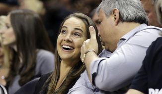 FILE - In this April 30, 2014, file photo, San Antonio Stars&#39; Becky Hammon walks off the court following Game 5 of the opening-round NBA basketball playoff series between the San Antonio Spurs and the Dallas Mavericks in San Antonio. Spurs coach Gregg Popovich believes Hammon and other women can cross over and coach men, even in the NBA. (AP Photo/Eric Gay, File)