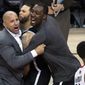 Brooklyn Nets head coach Jason Kidd, left, and teammates Deron Williams, center, and Andray Blatche react after defeating the Toronto Raptors in Game 7 of the opening-round NBA basketball playoff series in Toronto, Sunday, May 4, 2014. (AP Photo/The Canadian Press, Nathan Denette)