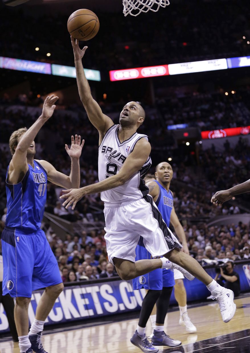 San Antonio Spurs&#39; Tony Parker (9), of France, shoots over Dallas Mavericks&#39; Dirk Nowitzki (41), of Germany, during the first half of Game 7 of the opening-round NBA basketball playoff series, Sunday, May 4, 2014, in San Antonio. (AP Photo/Eric Gay)